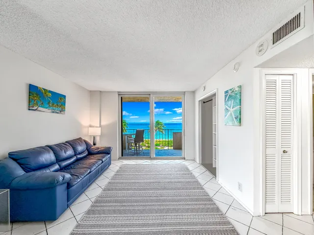 a view of a chairs and table in patio