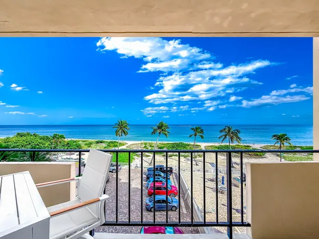 a white toilet sitting next to a bath tub and a shower