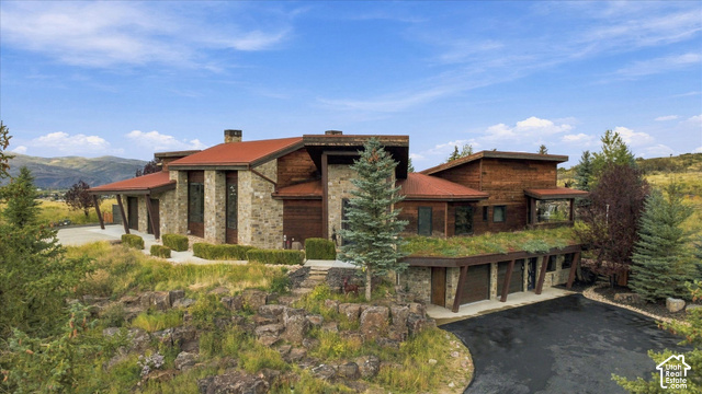 5936 Triple Crown Trail Oakley, UT 84055 - Photo 4 of 57 Stone and wood-clad exterior with a red tile roof
