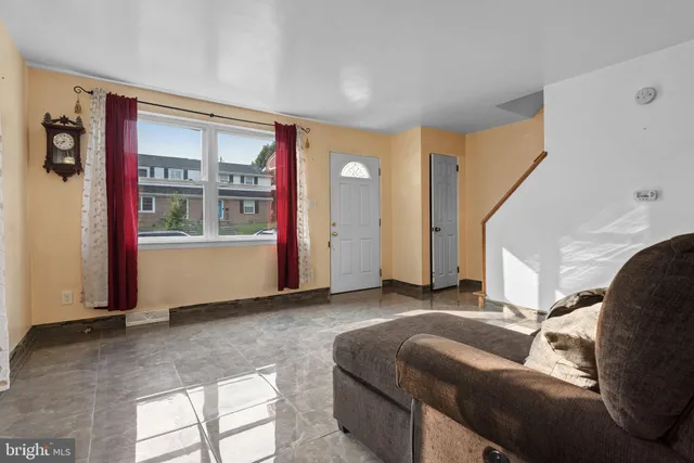 a living room with furniture and windows