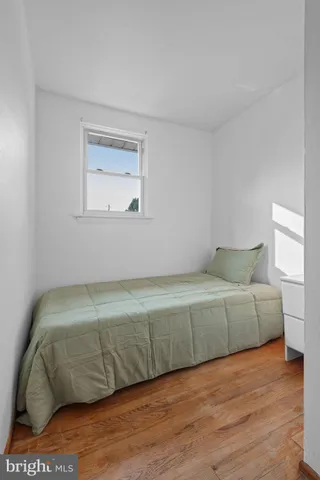 a bathroom with a toilet a sink and a mirror