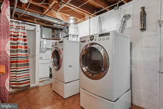 a white toilet sitting next to a bathroom sink