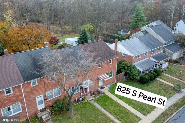 an aerial view of residential houses with outdoor space