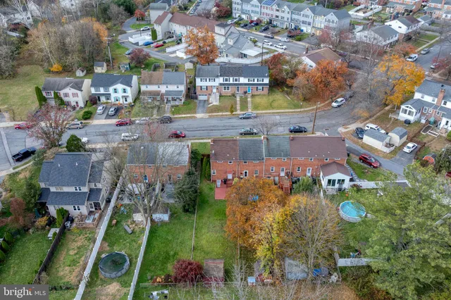an aerial view of a house with outdoor space