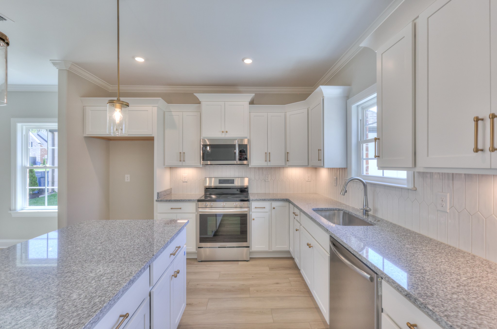 437 Ruby Oaks Lane Murfreesboro, TN 37128 - Photo 12 of 38 a open kitchen with stainless steel appliances granite countertop a sink stove and refrigerator