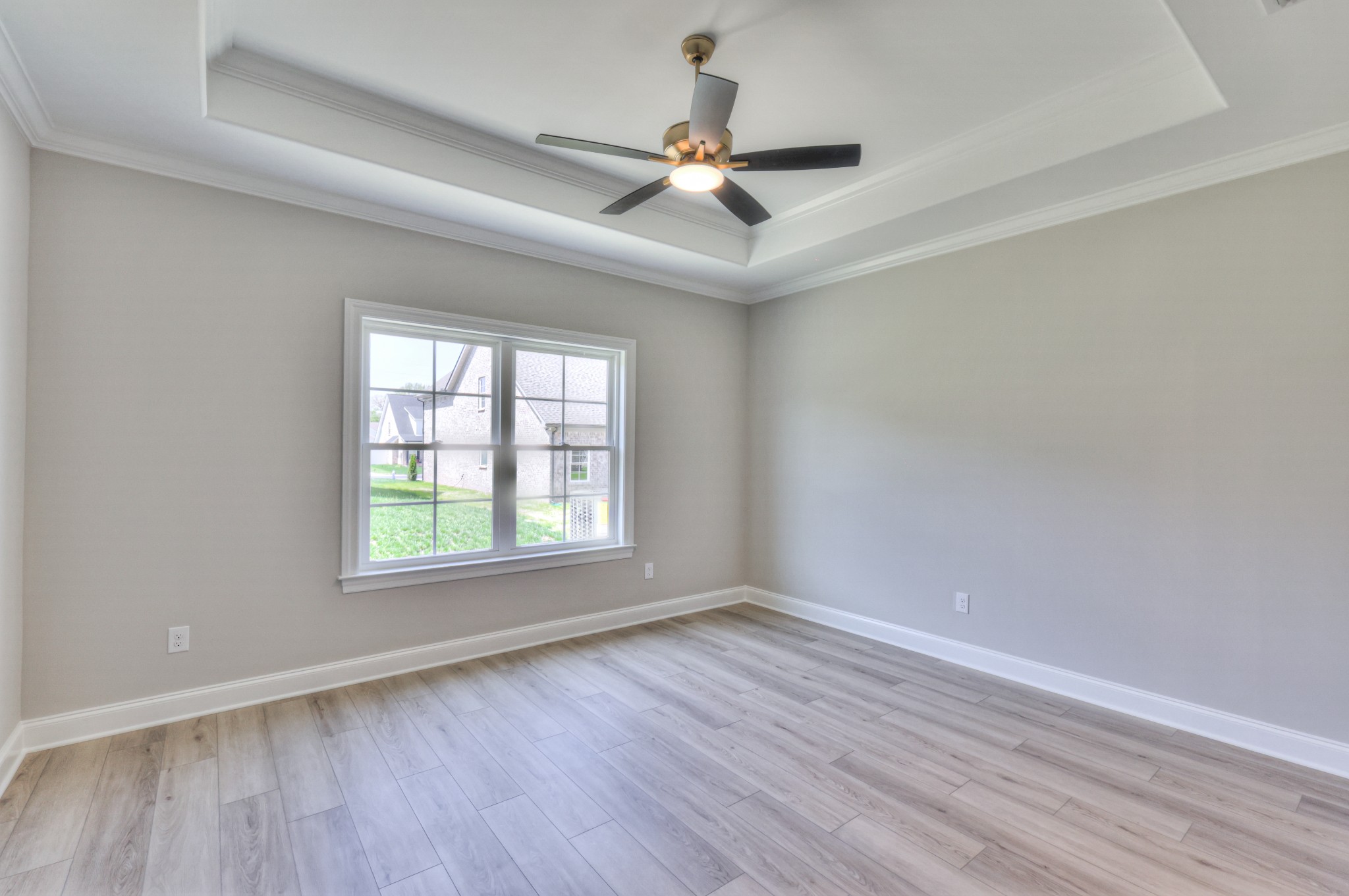437 Ruby Oaks Lane Murfreesboro, TN 37128 - Photo 18 of 38 an empty room with wooden floor fan and windows