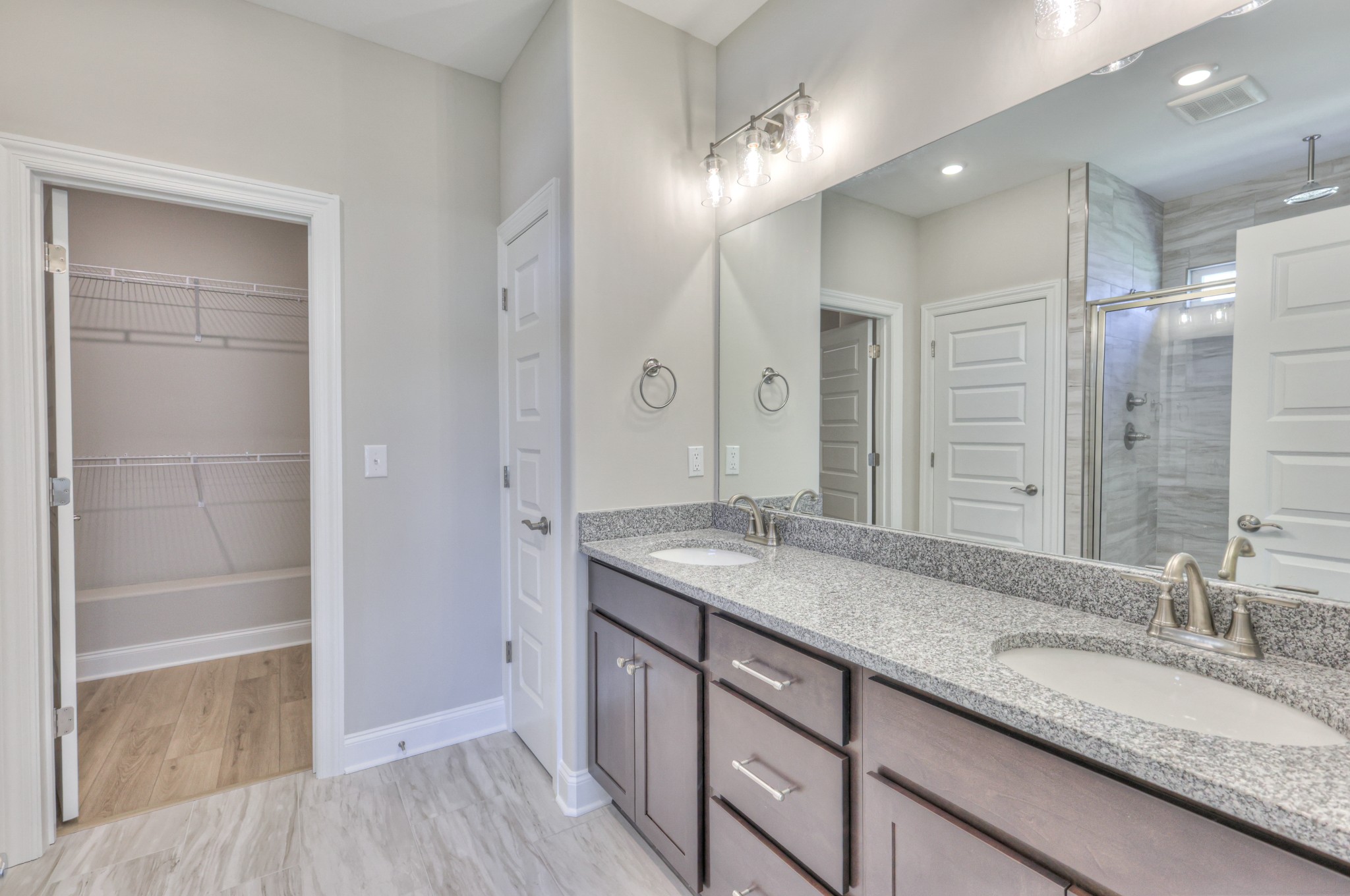 437 Ruby Oaks Lane Murfreesboro, TN 37128 - Photo 21 of 38 a bathroom with a granite countertop sink and a mirror