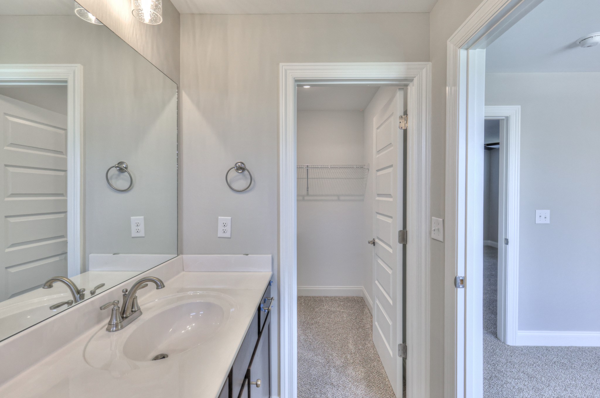 437 Ruby Oaks Lane Murfreesboro, TN 37128 - Photo 26 of 38 a bathroom with a sink a mirror and a shower