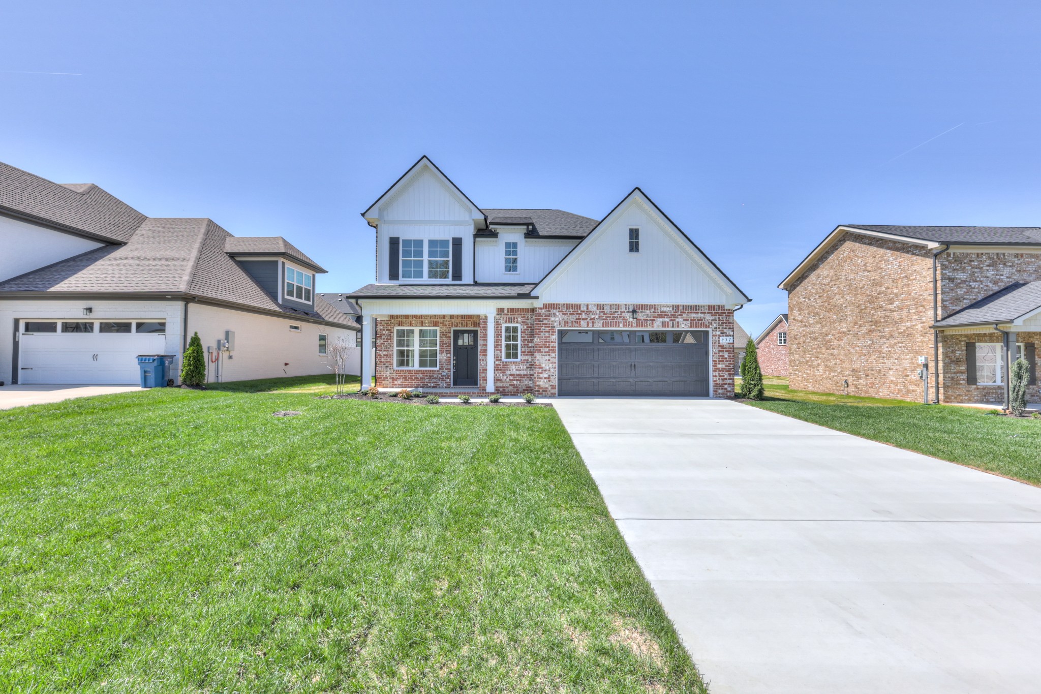 437 Ruby Oaks Lane Murfreesboro, TN 37128 - Photo 3 of 38 a front view of a house with a yard and garage