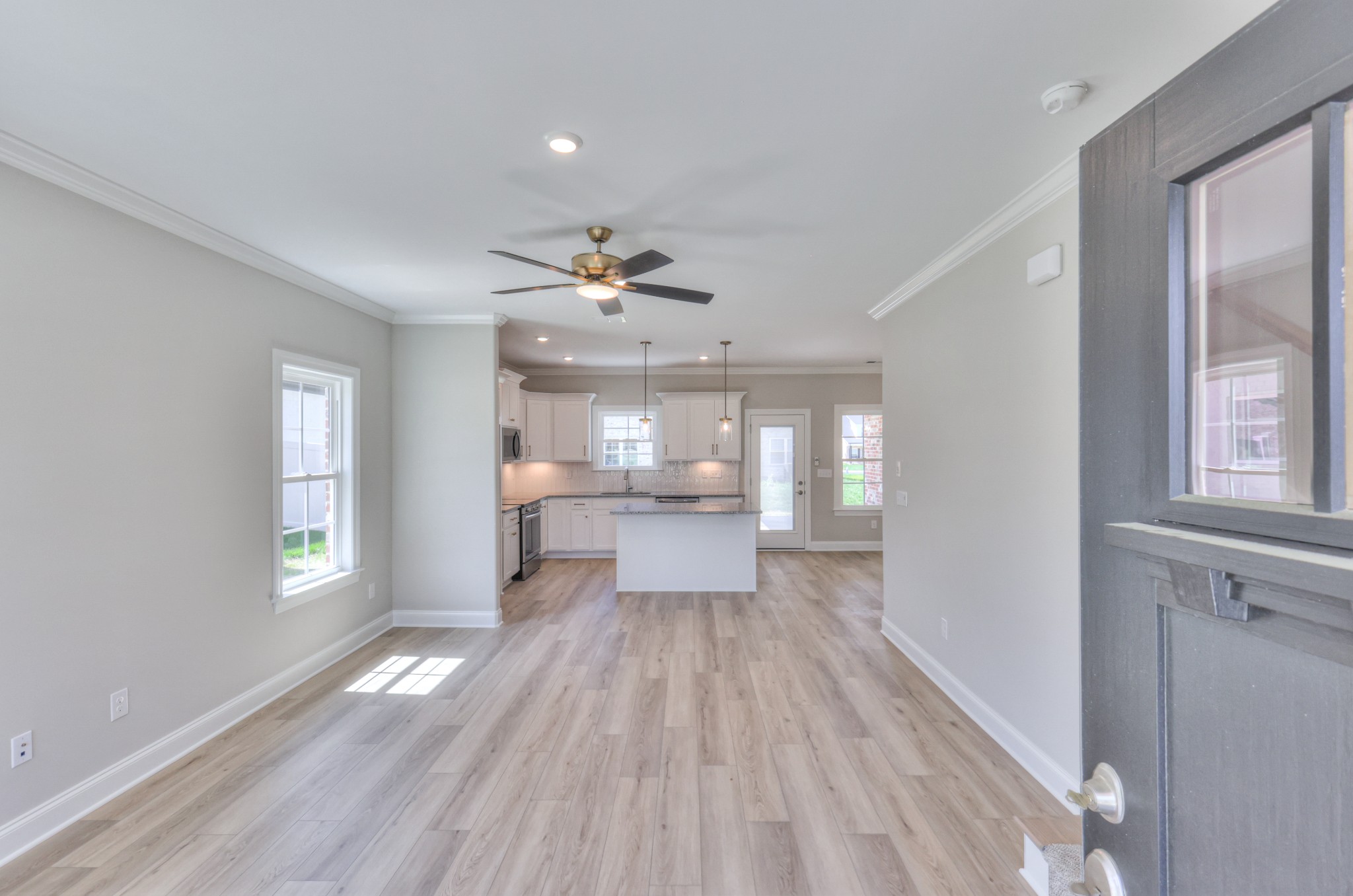 437 Ruby Oaks Lane Murfreesboro, TN 37128 - Photo 4 of 38 a view of a room with wooden floor windows and chandelier