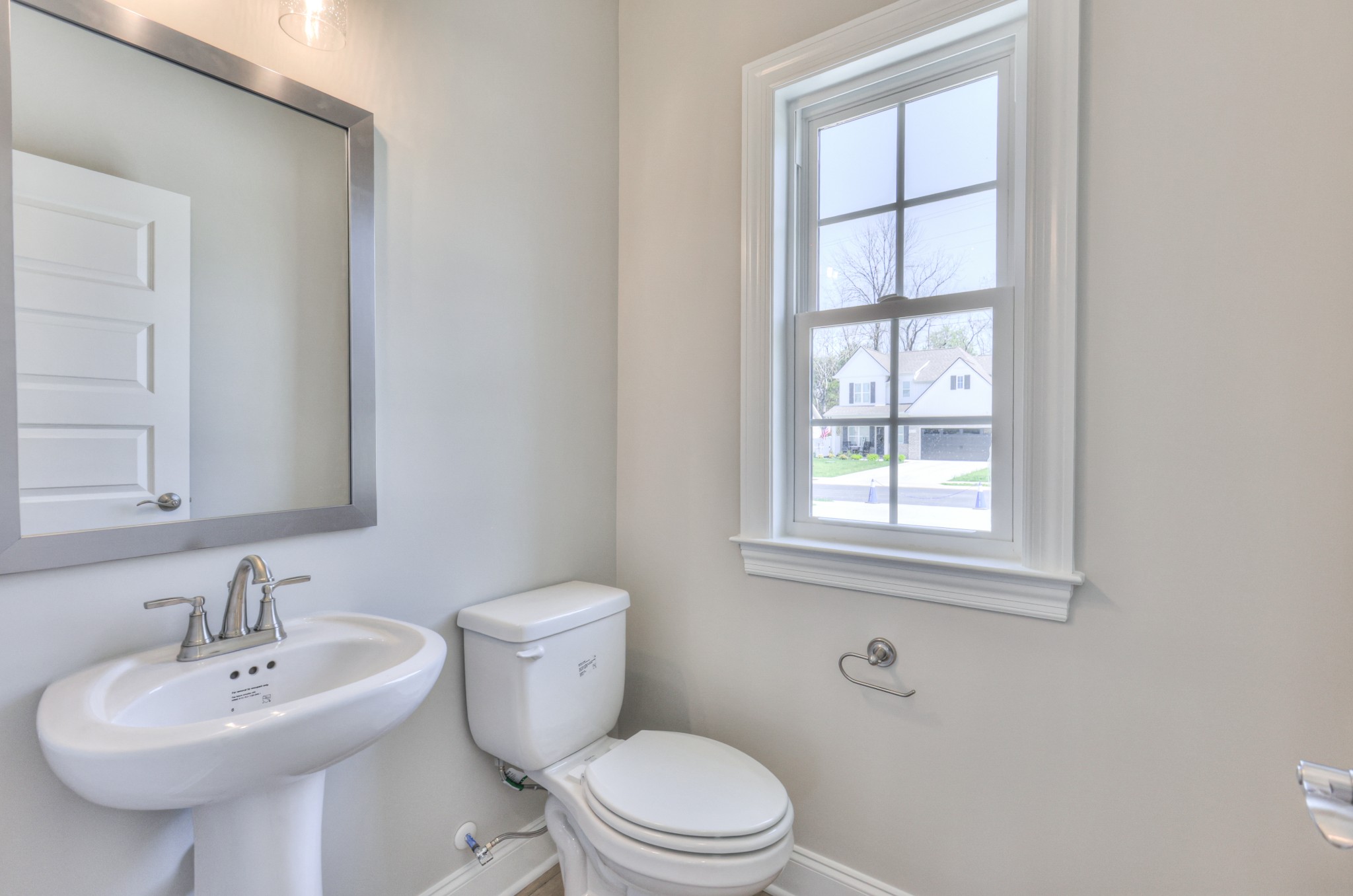 437 Ruby Oaks Lane Murfreesboro, TN 37128 - Photo 7 of 38 a bathroom with a sink a toilet and a window