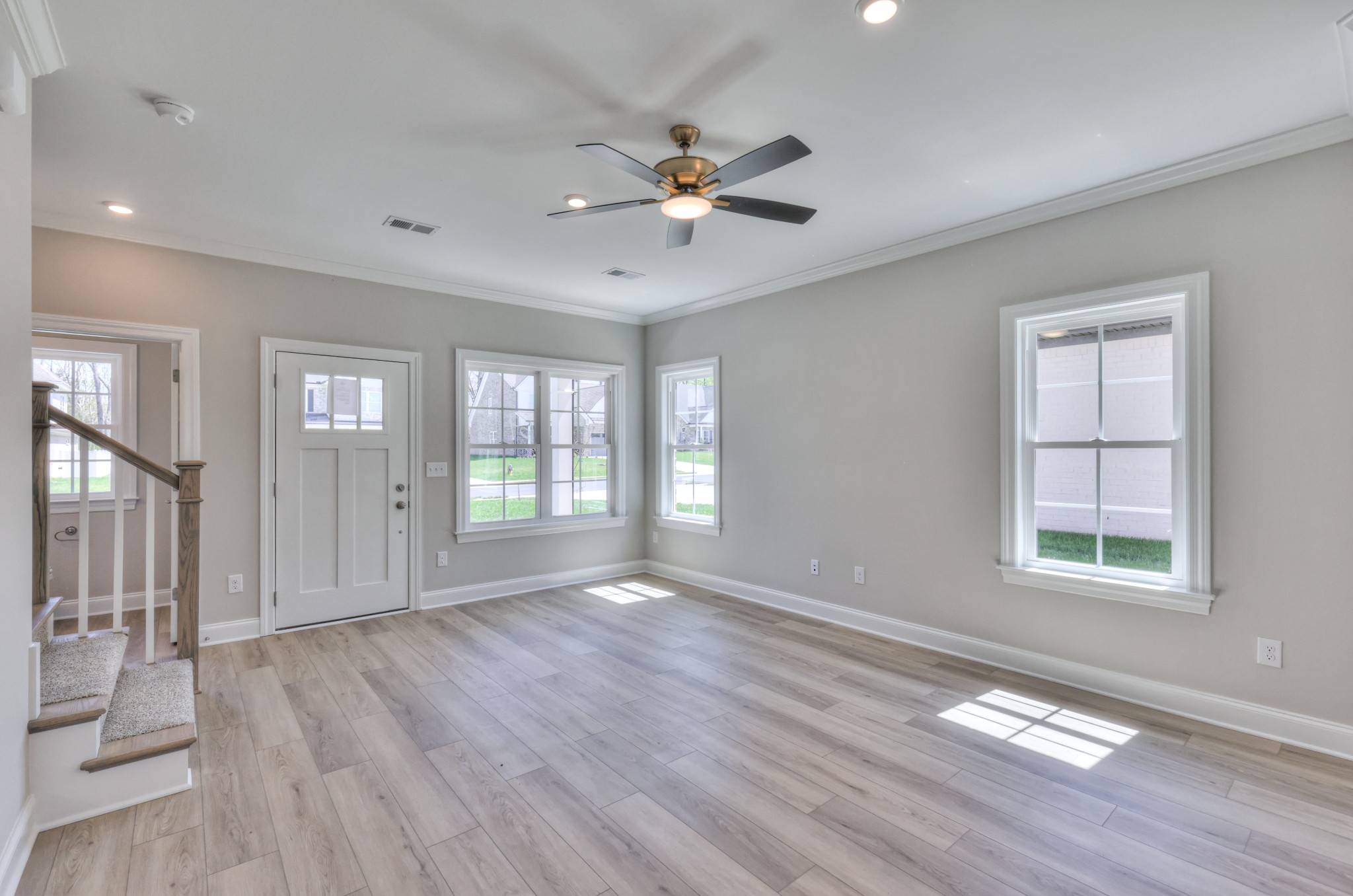 437 Ruby Oaks Lane Murfreesboro, TN 37128 - Photo 8 of 38 a view of an empty room with wooden floor and a window