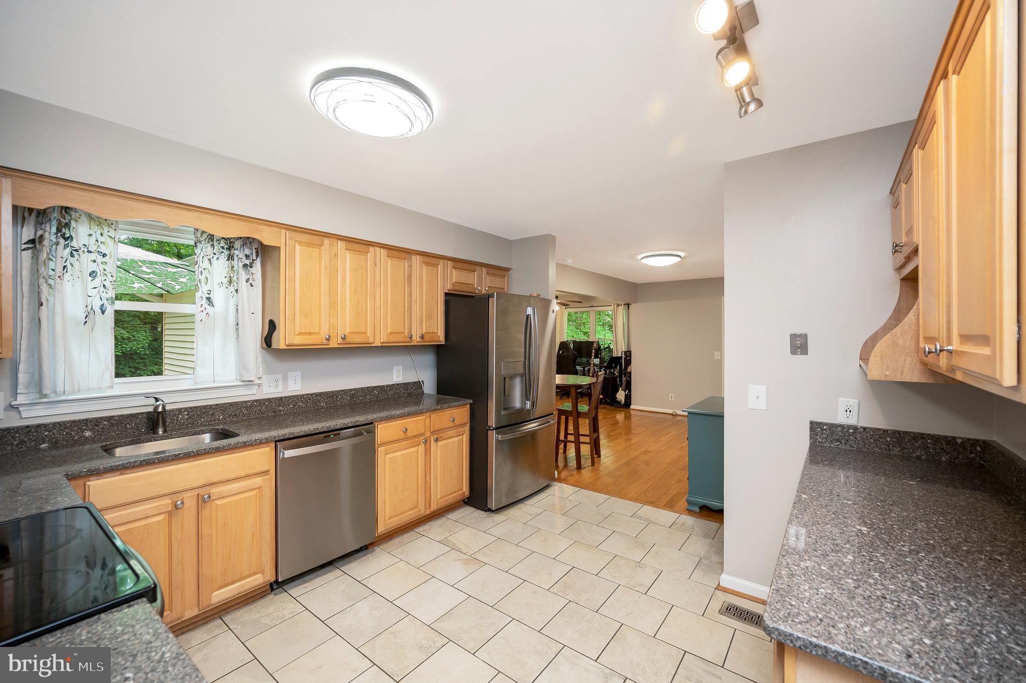 679 Cropp Road Fredericksburg, VA 22406 - Photo 14 of 39 a large white kitchen with a large window