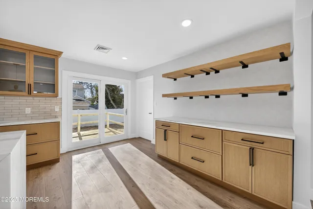 a spacious bedroom with a large bed and furniture