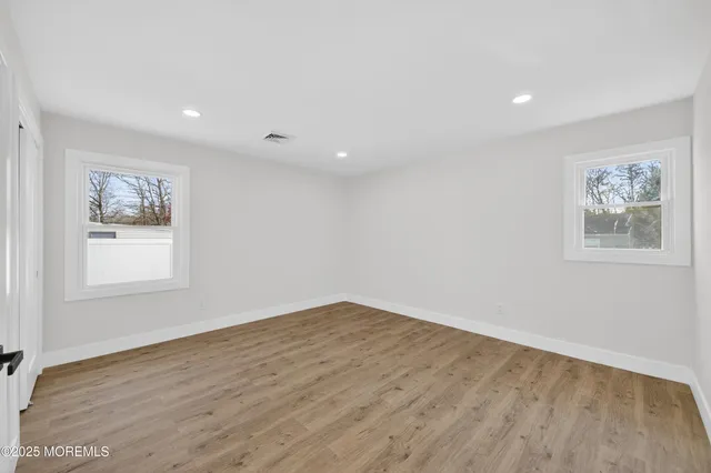 a bedroom with a large bed and a couch