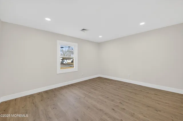 a spacious bedroom with a bed and a desk