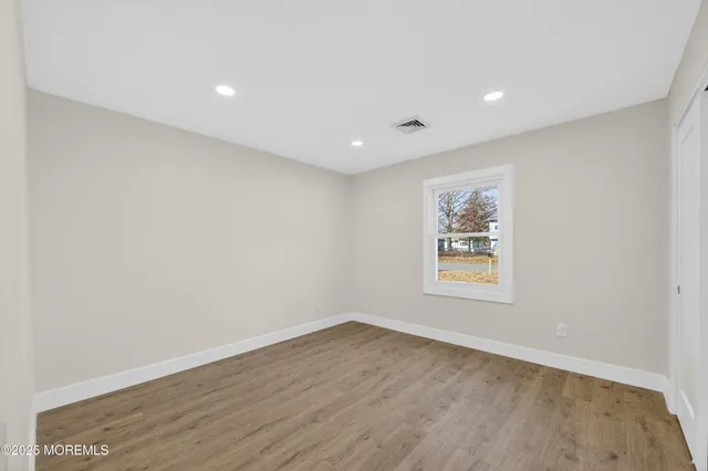 a bedroom with a bed and chair