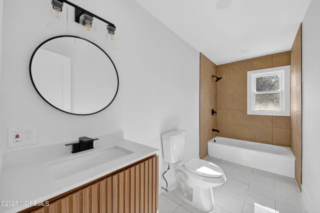 a bathroom with a bathtub and shower