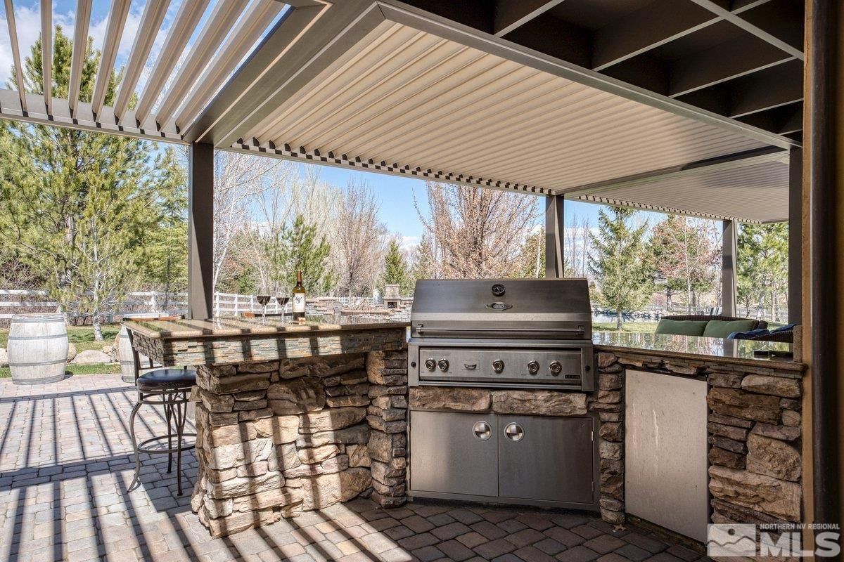 3255 Kinney Court Reno, NV 89511 - Photo 30 of 38 a table and chairs in front of a house