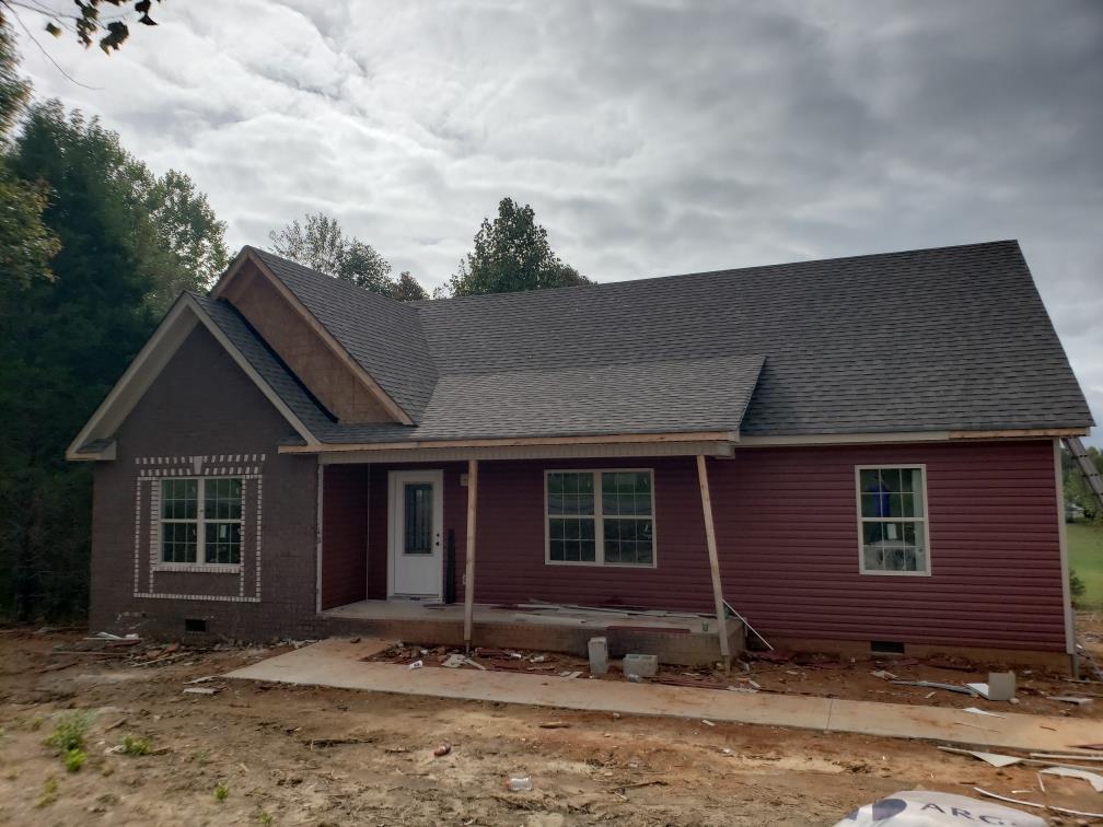 114 East Carter Road Portland, TN 37148 - Photo 1 of 3 a front view of a house with a yard