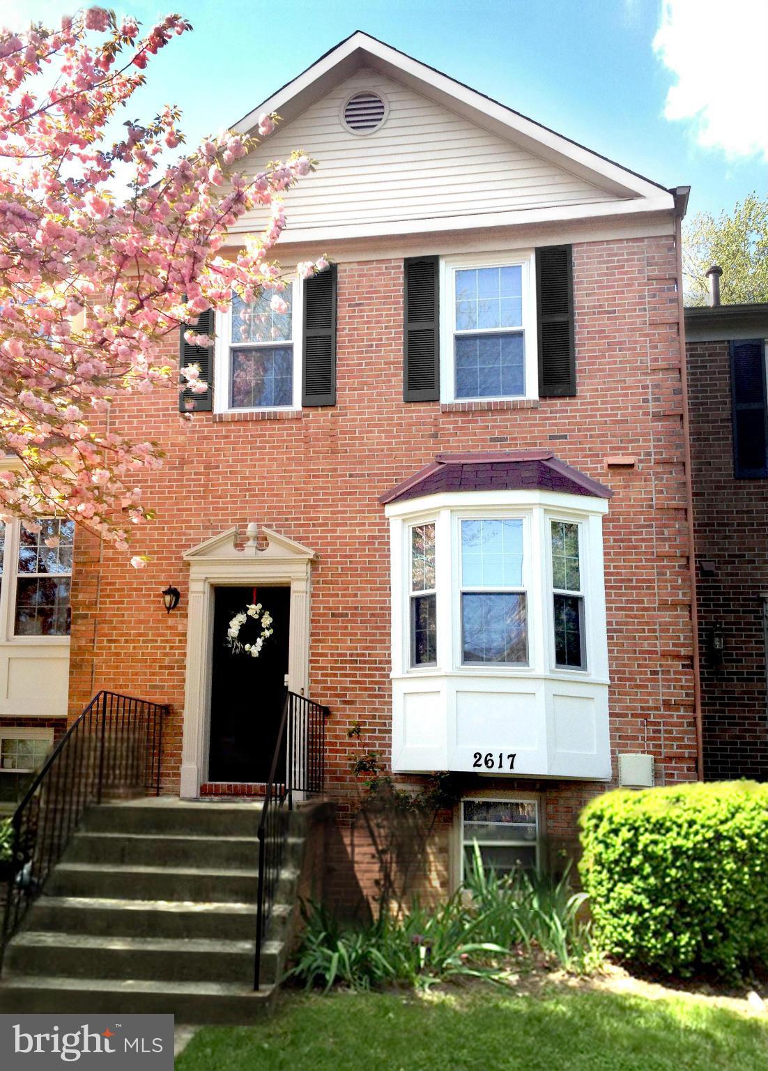2617 Chivalry Court Silver Spring, MD 20902 - Photo 1 of 20 a front view of a house with a yard