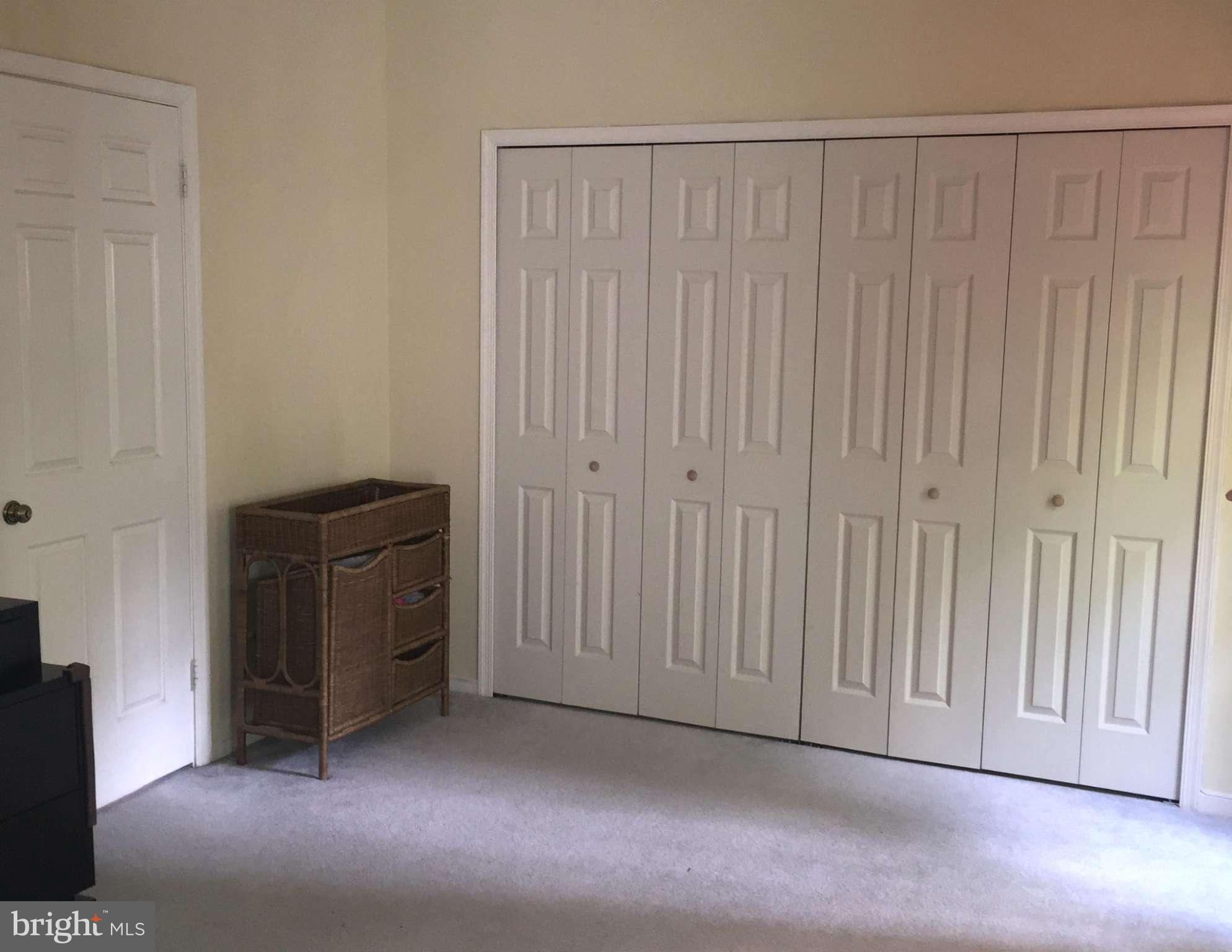 2617 Chivalry Court Silver Spring, MD 20902 - Photo 16 of 20 a view of a closet with wooden floor