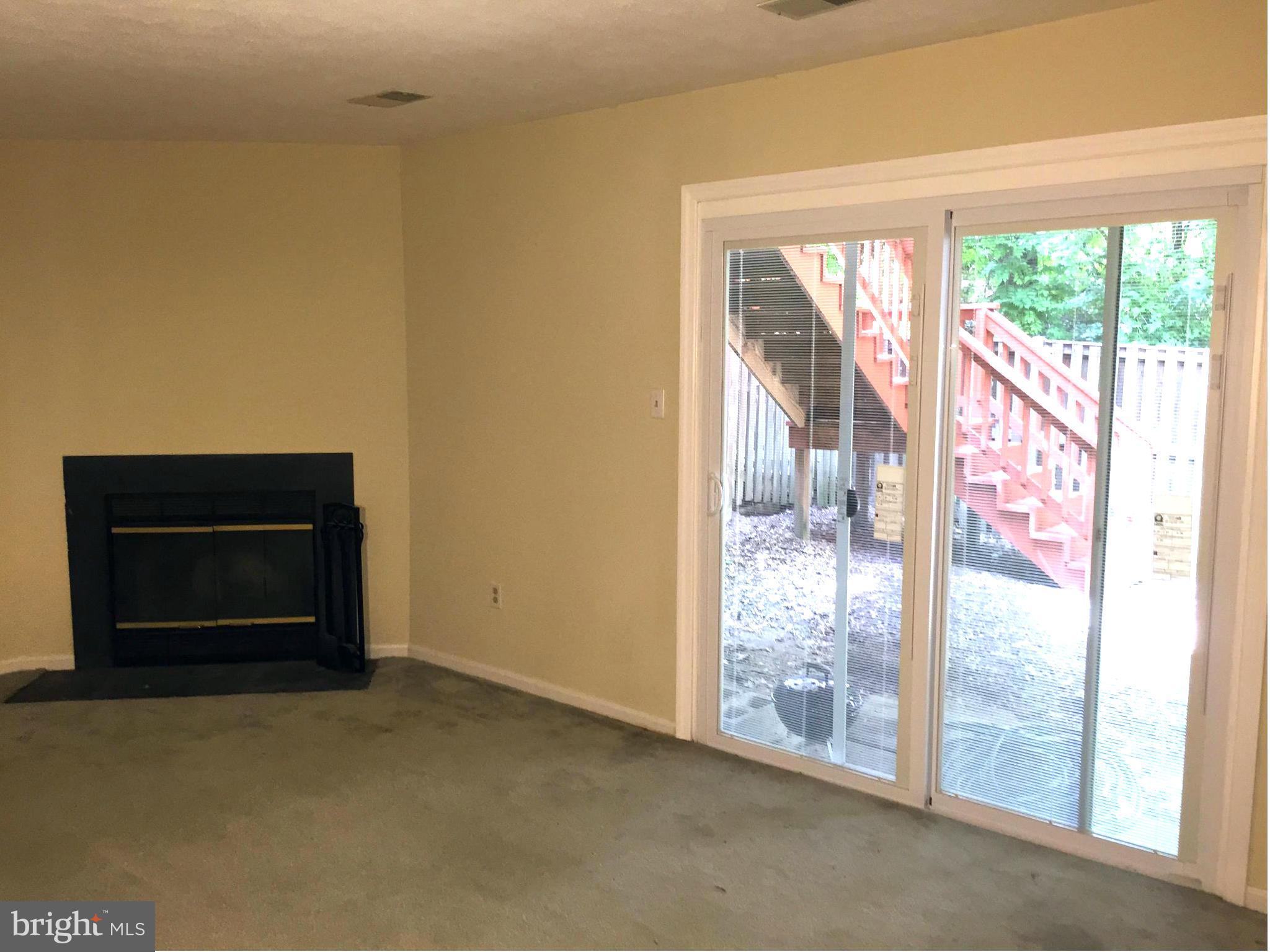 2617 Chivalry Court Silver Spring, MD 20902 - Photo 18 of 20 a room with a fireplace