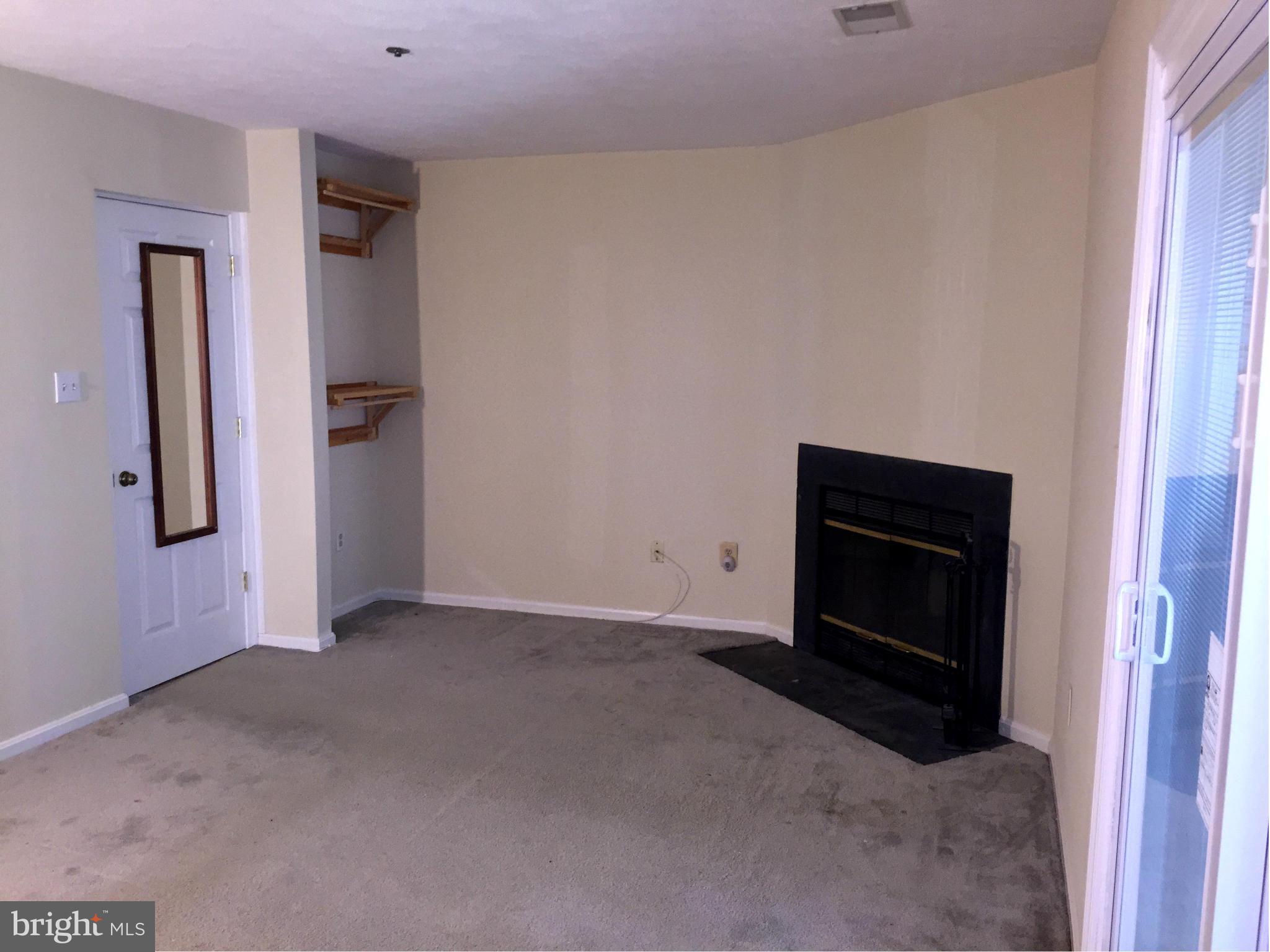 2617 Chivalry Court Silver Spring, MD 20902 - Photo 19 of 20 a view of an empty room and fire place