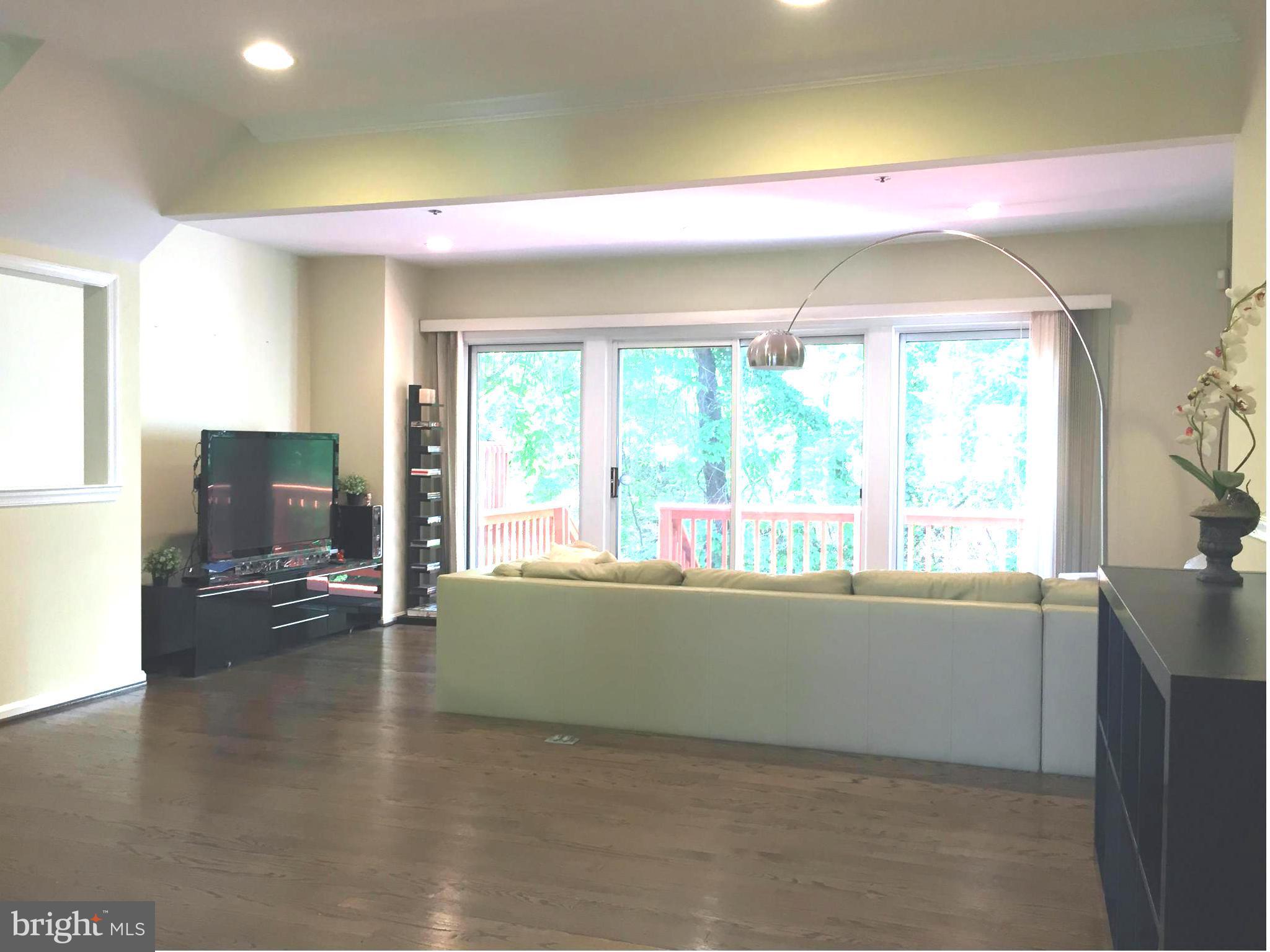 2617 Chivalry Court Silver Spring, MD 20902 - Photo 7 of 20 a living room with furniture and a flat screen tv