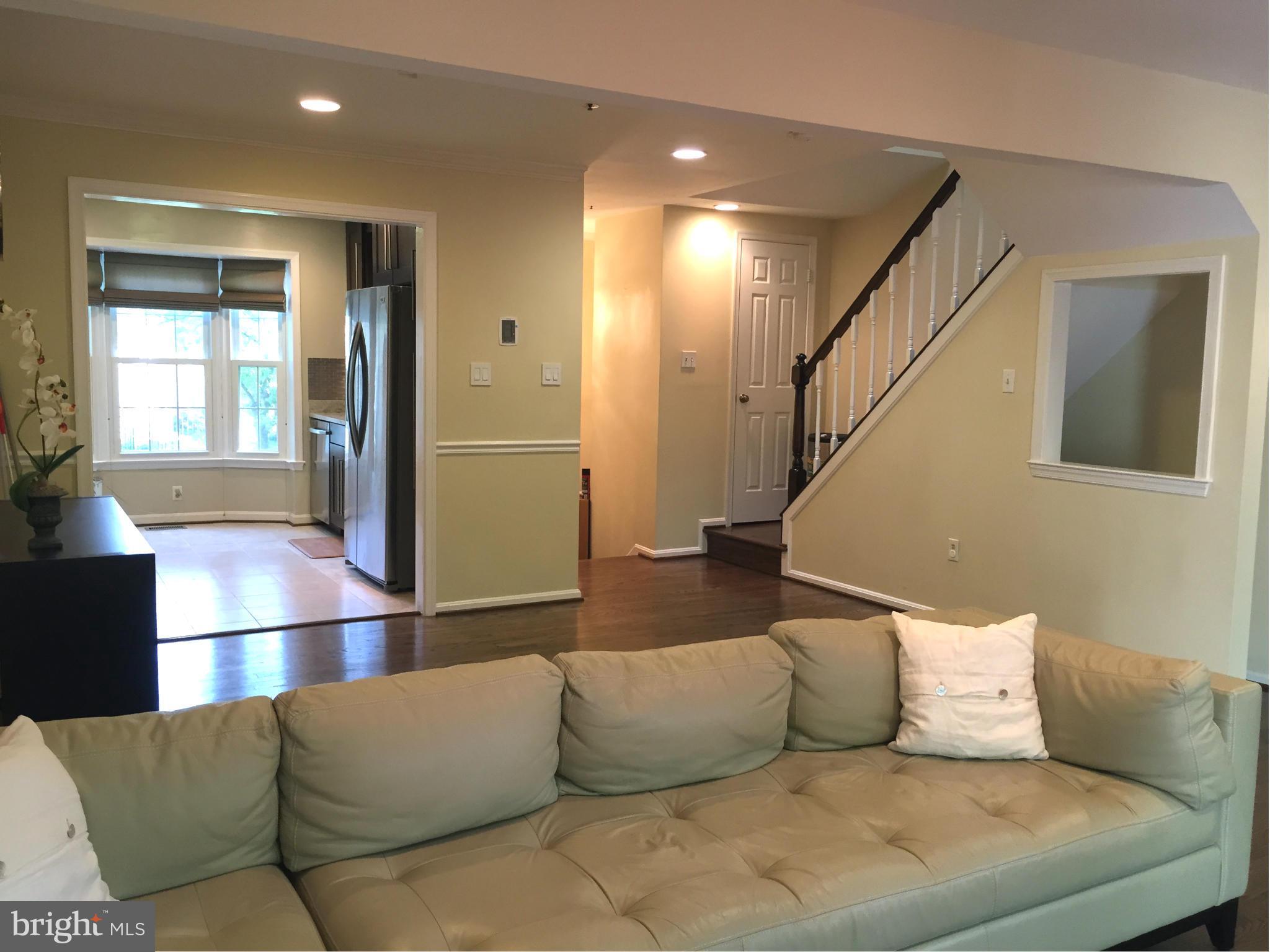 2617 Chivalry Court Silver Spring, MD 20902 - Photo 8 of 20 a living room with furniture and a potted plant