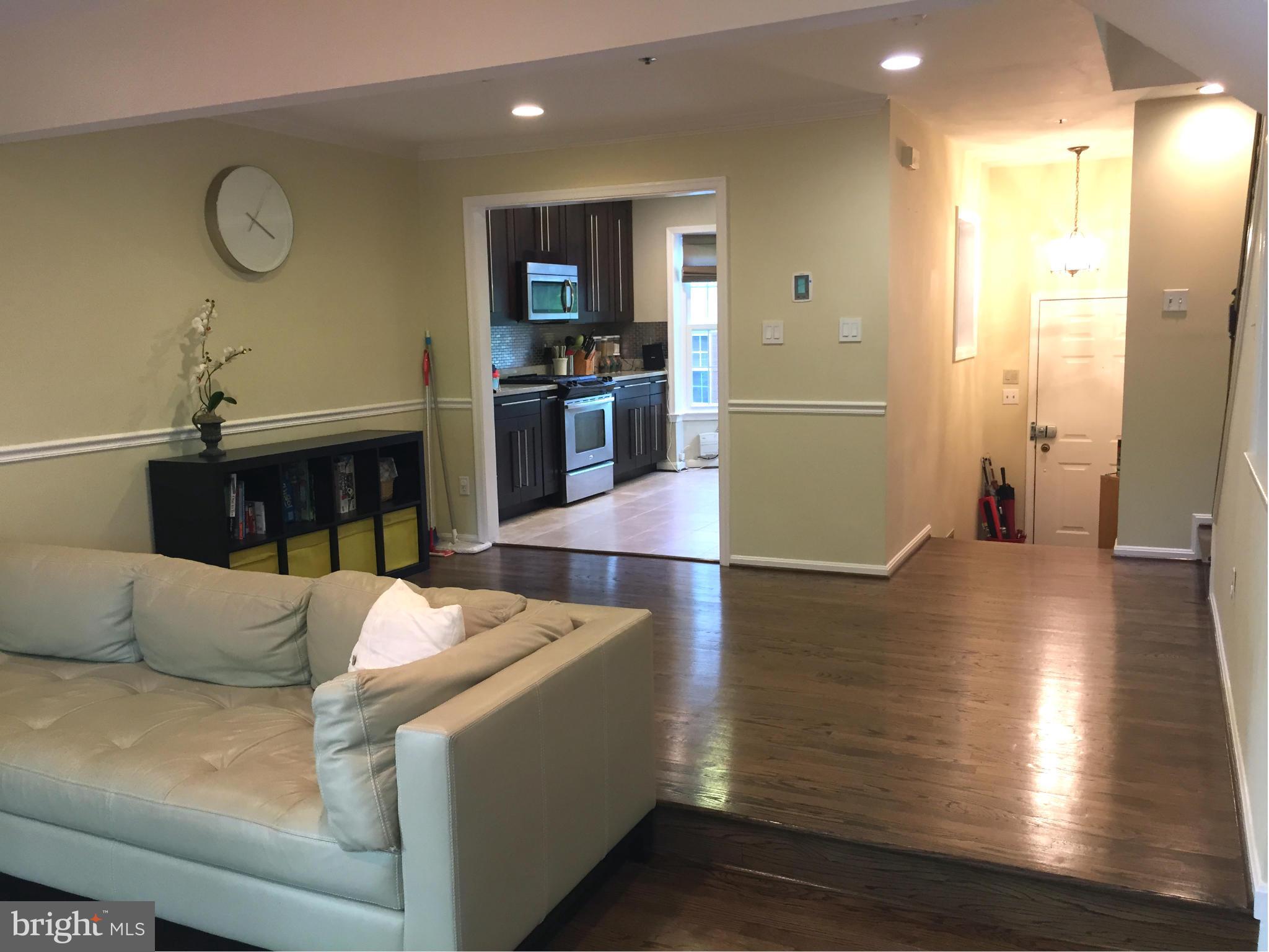 2617 Chivalry Court Silver Spring, MD 20902 - Photo 10 of 20 a living room with furniture and a wooden floor