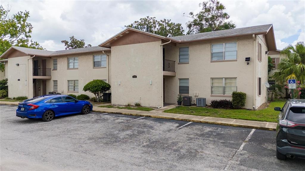 1918 Honour Road, Unit 4 Orlando, FL 32839 - Photo 17 of 17 a front view of a house with a yard and garage