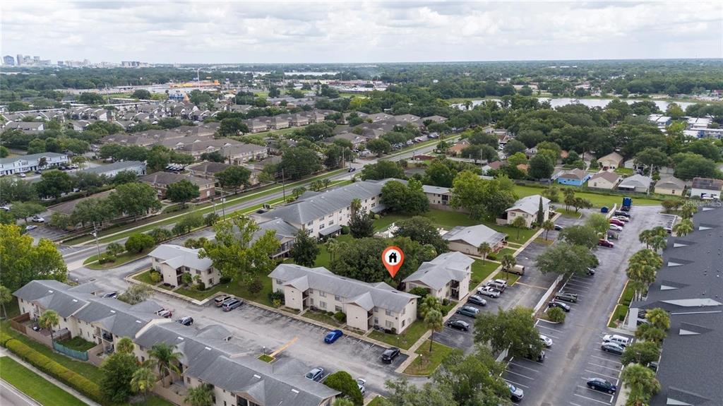 1918 Honour Road, Unit 4 Orlando, FL 32839 - Photo 2 of 17 an aerial view of a city with lots of residential buildings