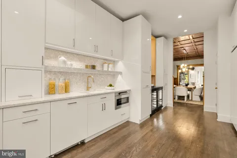a kitchen with stainless steel appliances a sink and cabinets