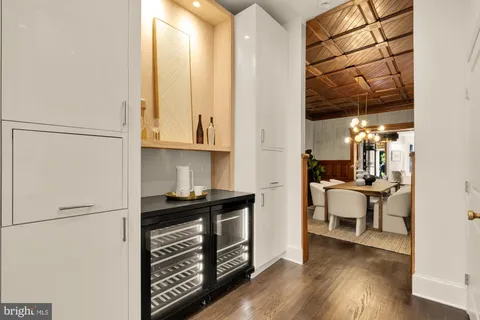 a view of kitchen with furniture and wooden floor