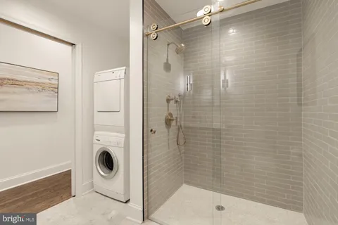 a bathroom with a shower and a sink