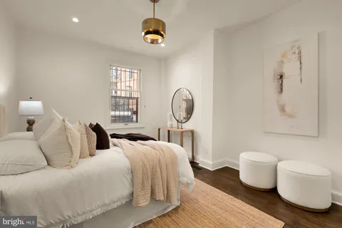 a bedroom with double bed and a window