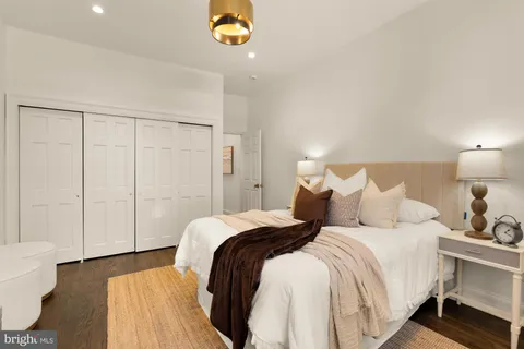 a bed room with a bed and a lamp