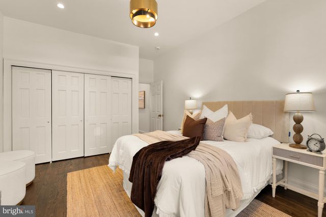 a bed room with a bed and a lamp