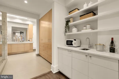 a bathroom with a shower and a sink
