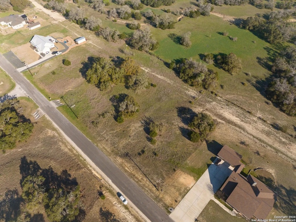 327 John Price Blanco, TX 78606 - Photo 8 of 12 view of a fireplace with wooden floor