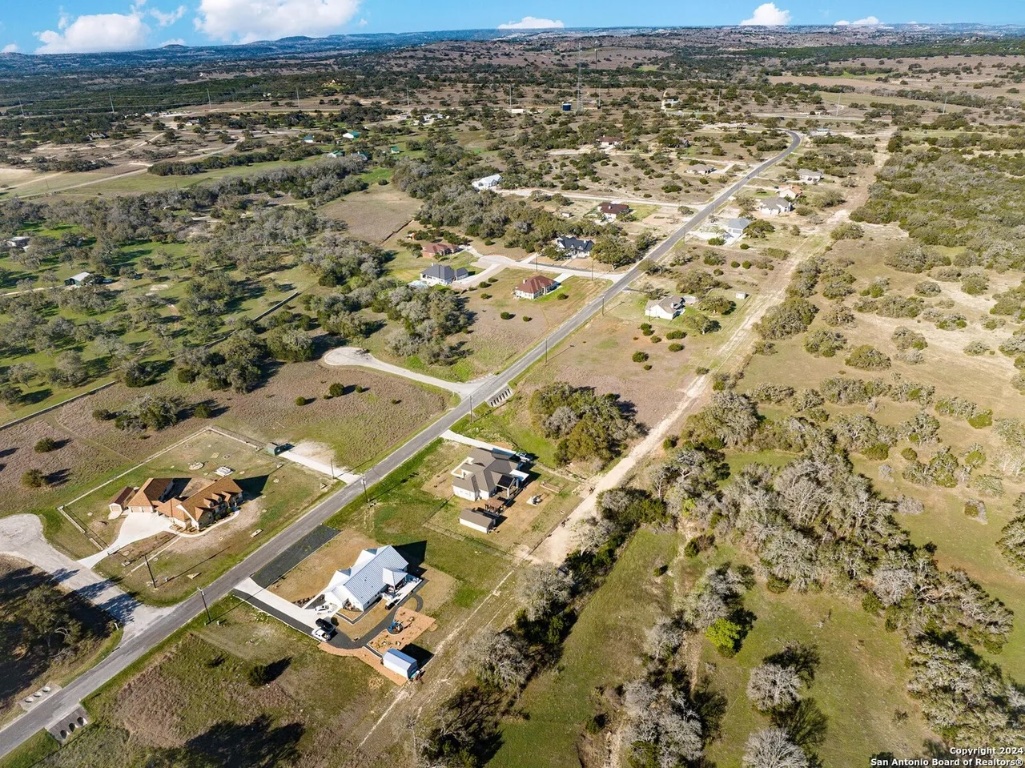 327 John Price Blanco, TX 78606 - Photo 9 of 12 an aerial view of residential houses with outdoor space