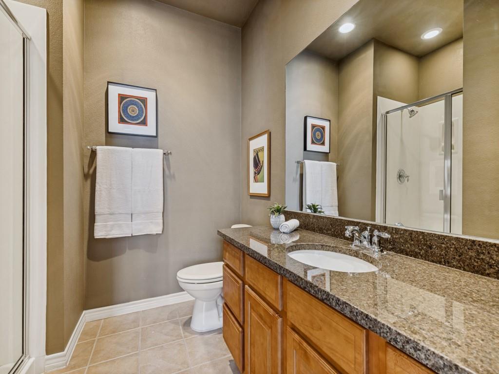 15741 Seabolt Place, Unit 28 Addison, TX 75001 - Photo 19 of 37 Full bathroom featuring a stall shower, vanity, and light tile patterned floors