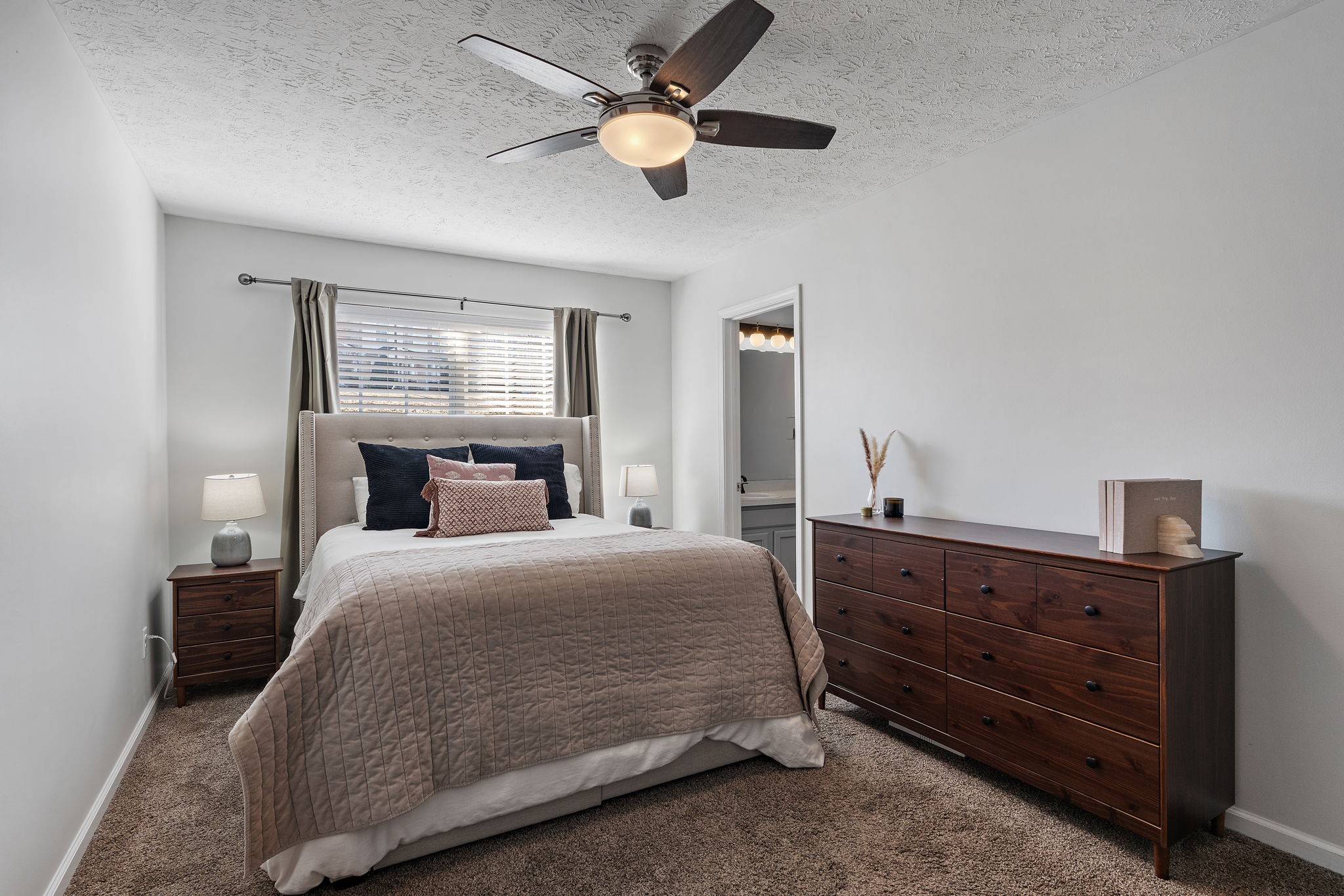 415 Shadow Glen Drive Nashville, TN 37211 - Photo 19 of 27 a bedroom with a bed and a chandelier