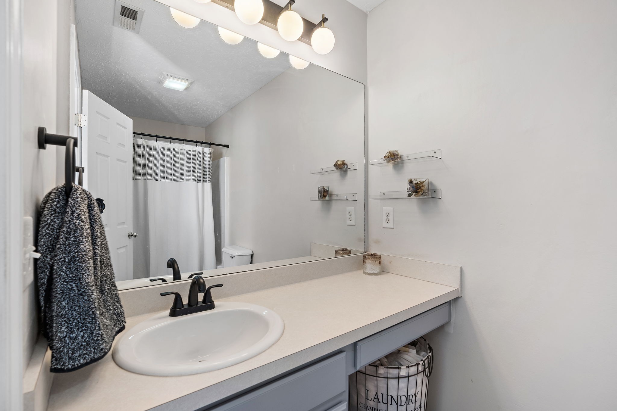 415 Shadow Glen Drive Nashville, TN 37211 - Photo 21 of 27 a bathroom with a sink and a mirror