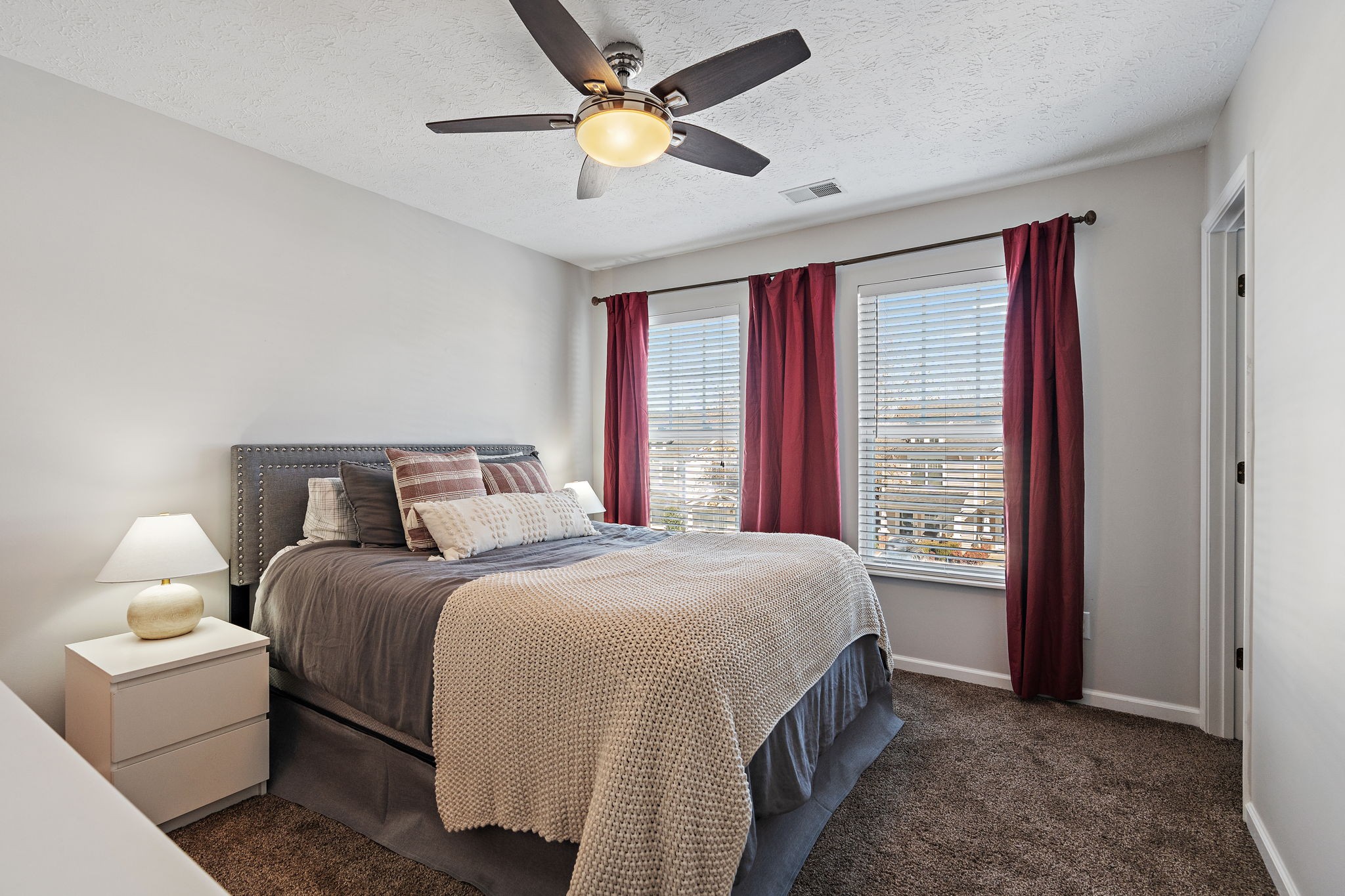 415 Shadow Glen Drive Nashville, TN 37211 - Photo 23 of 27 a bedroom with a bed and a ceiling fan