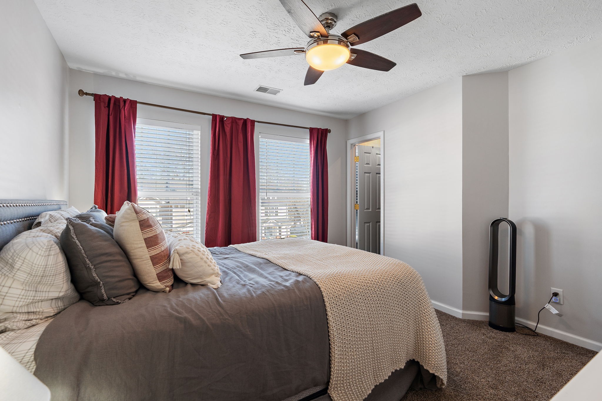 415 Shadow Glen Drive Nashville, TN 37211 - Photo 24 of 27 a bedroom with a bed and a chandelier