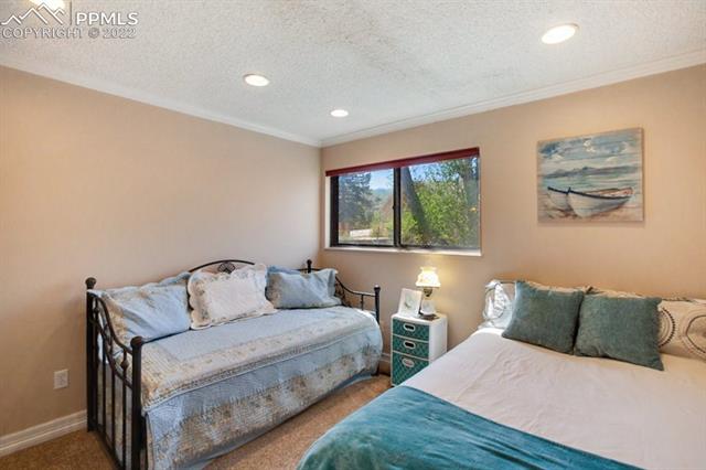 691 Gilcrest Road Colorado Springs, CO 80906 - Photo 14 of 28 Spacious upstairs bedroom