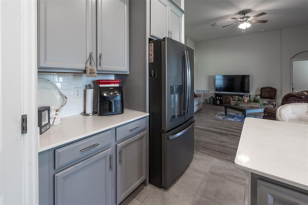 9224 Southwest 60th Ct Road Ocala, FL 34476 - Photo 14 of 55 a kitchen with stainless steel appliances granite countertop a refrigerator and a sink
