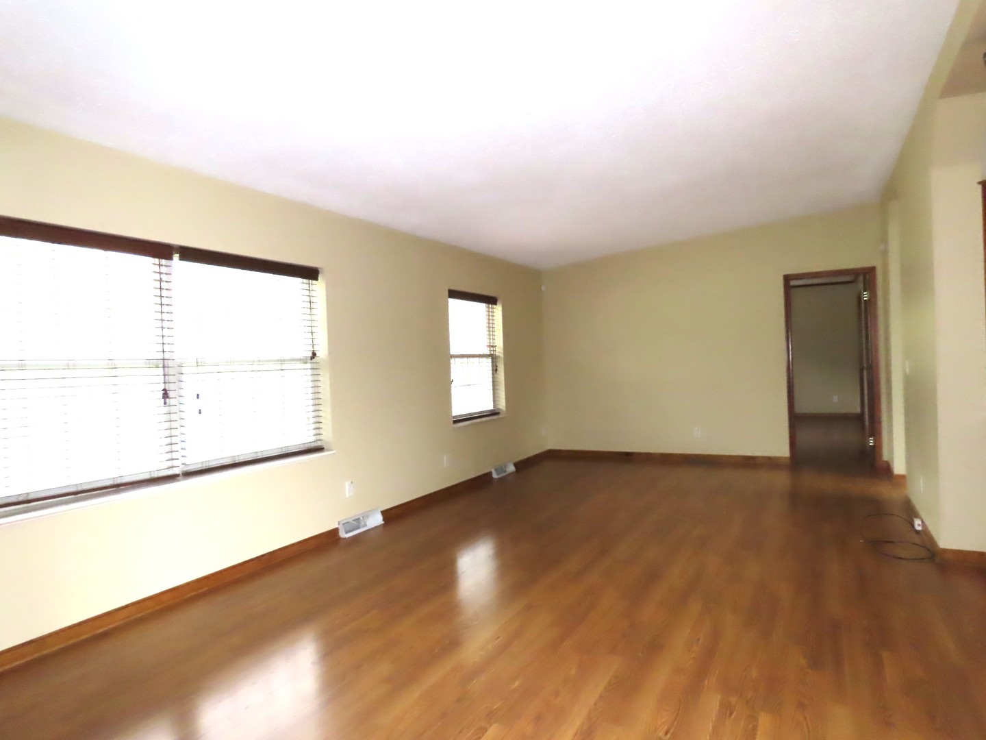2968 North 2659th Road Seneca, IL 61360 - Photo 11 of 20 an empty room with wooden floor and windows